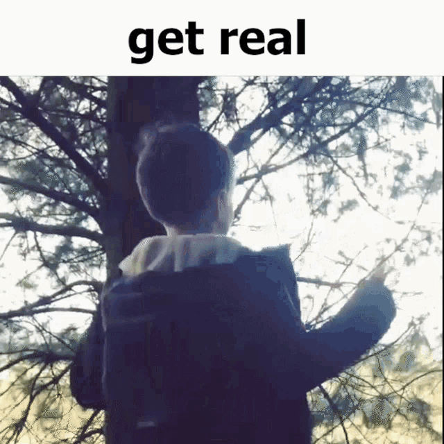 a picture of a person standing in front of a tree with the words " get real " above them