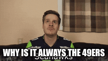 a man is sitting on a couch with the words why is it always the 49ers