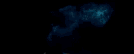 a dark background with a light coming out of it