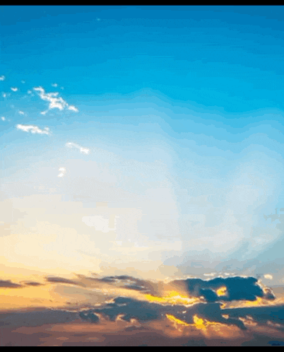 the sun shines through the clouds in the sky