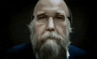 a man with a beard is smoking a cigar
