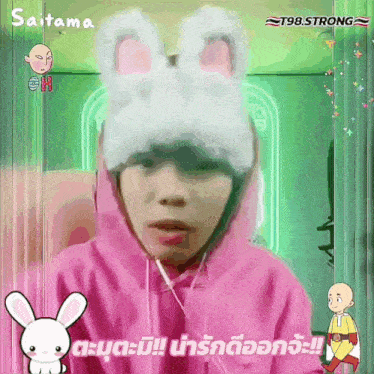 a person wearing a pink hoodie and a white hat with bunny ears