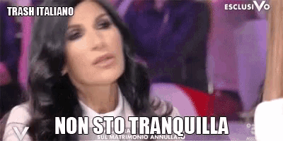 a woman in a white shirt says non sto tranquilla on a tv screen
