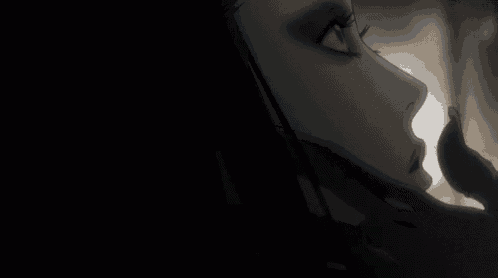 a close up of a woman 's eye with a blue eyeshadow