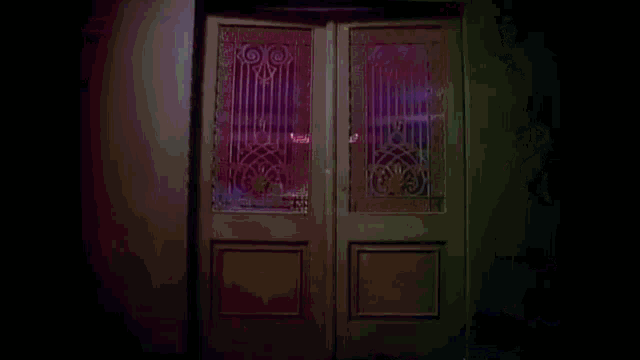 a door that is open to a purple room