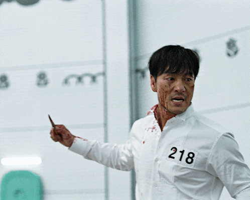 a man in a white shirt with the number 218 on his shirt