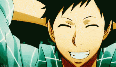 a close up of a person 's face with their eyes closed and a smile on their face