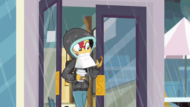 a girl in a hoodie is holding a cup of coffee and a piece of paper