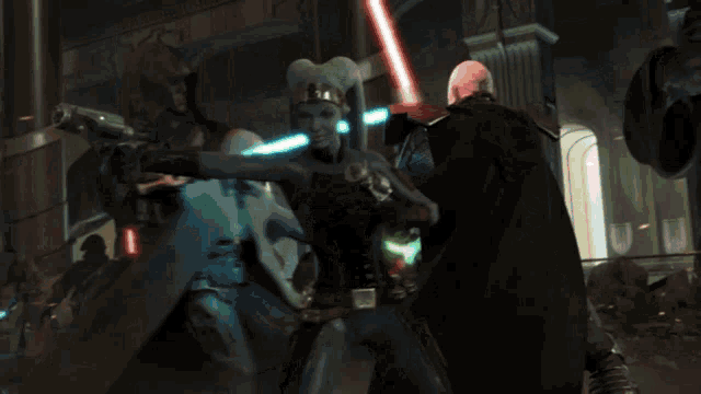 a man is holding a green light saber in a dark room