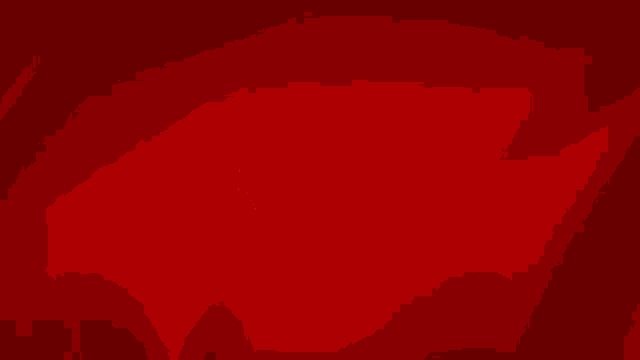 a red shield with the word nimes on it
