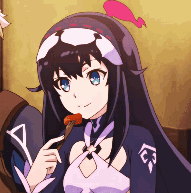 a girl with long black hair and blue eyes is eating a piece of food with a fork