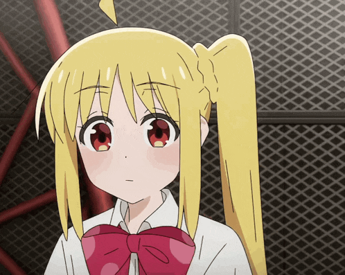 a girl with blonde hair and red eyes is wearing a red bow tie