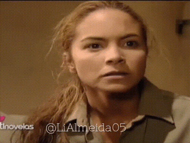 a close up of a woman 's face with the hashtag lialmeida05 on the bottom right