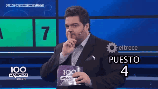 a man holds a sign that says 100 argentinas