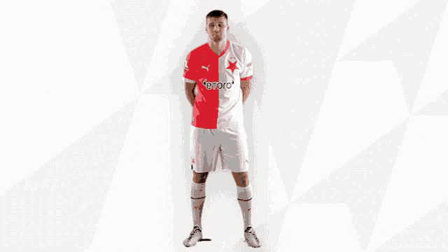 a man in a red and white soccer uniform with the word etoro on it