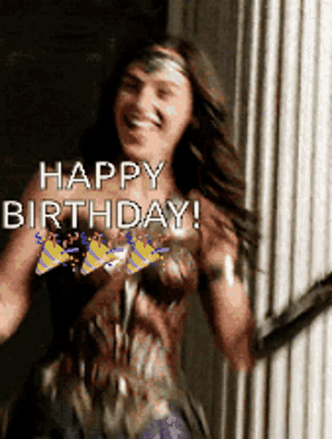 a woman in a wonder woman costume is smiling and wishing someone a happy birthday