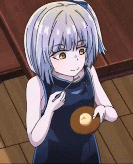 a girl in a blue dress is eating a donut with a spoon