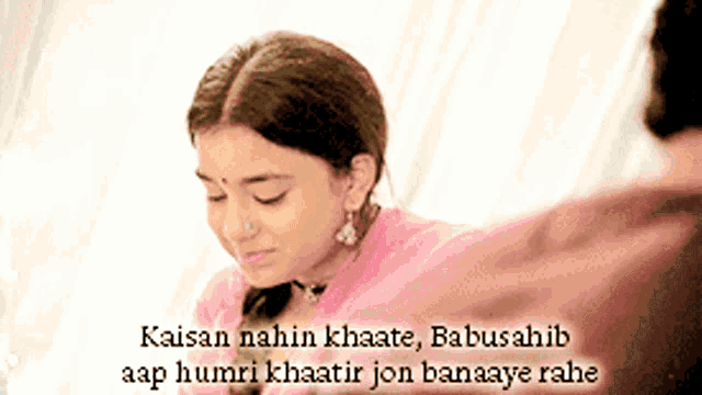 a woman in a pink shirt with a nose ring and a caption that says kaisan nahin khaate babusahib