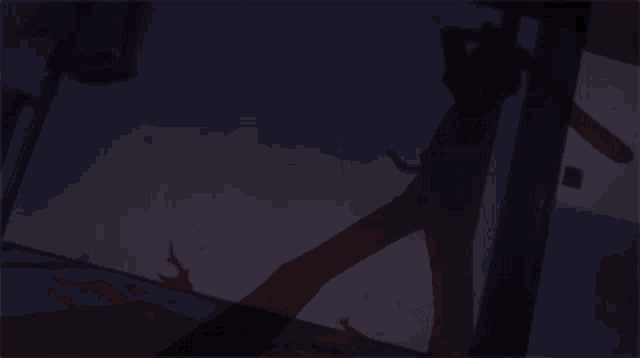 a silhouette of a person standing in front of a door