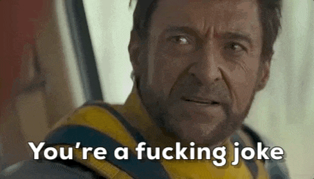 a man with a beard is making a funny face and saying `` you 're a fucking joke `` .