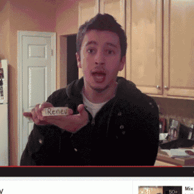 a man in a kitchen holding a piece of paper that says renew