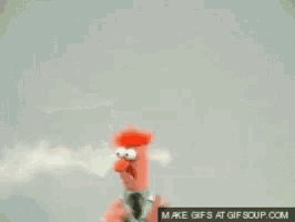 a blurred image of a cartoon character with the words make gifs at gifsoup.com on the bottom