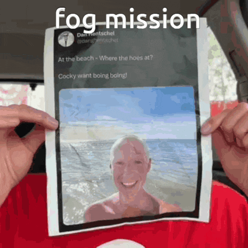 a person is holding a piece of paper with a picture of a man and the words fog mission on it