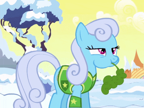 a blue pony with a green leaf in her mouth