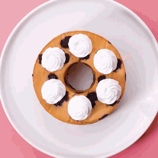 a donut with whipped cream on top of it