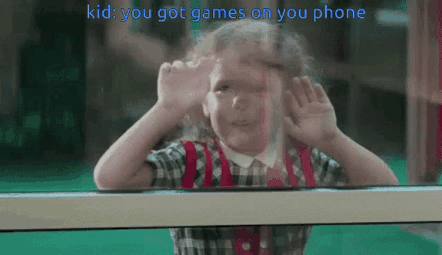 a little girl looking out a window with the words kid you got games on your phone written above her