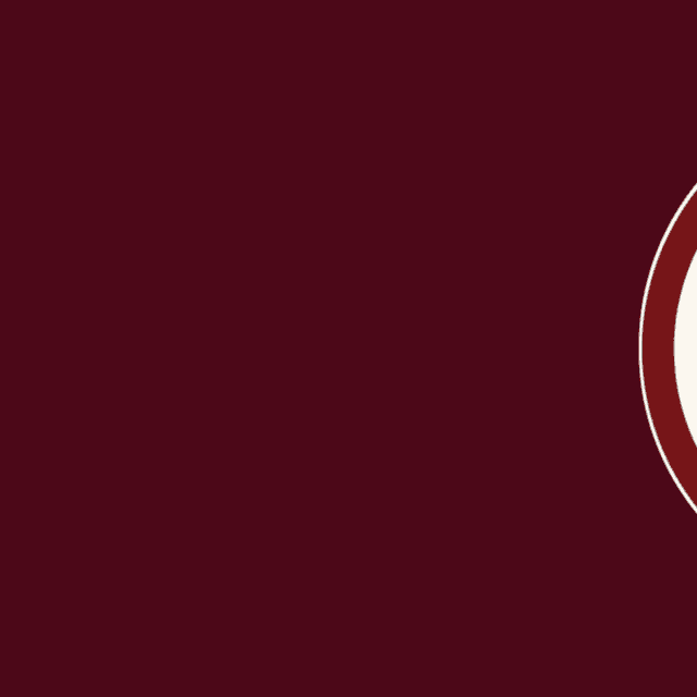 a letter u is in a circle on a dark background