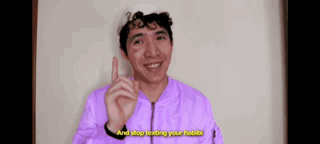 a man in a purple jacket is giving a warning to stop texting