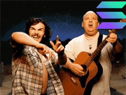two men are standing next to each other one is holding a guitar