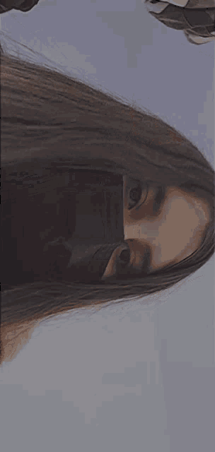 a close up of a woman 's face with a mask on