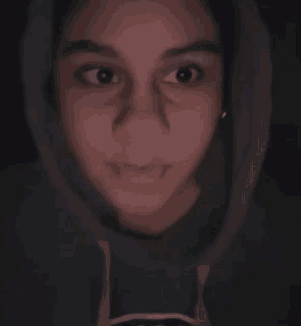 a woman wearing a hoodie with the letter l on it