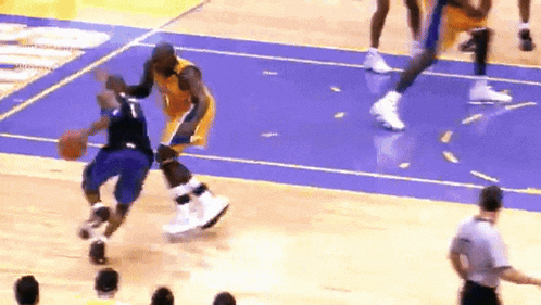 a basketball player with the number 1 on his jersey is dribbling a basketball