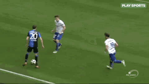 a group of soccer players are playing a game of soccer on a field .