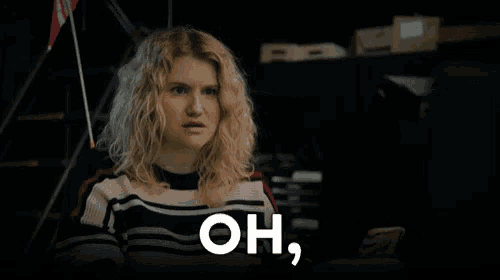 a woman with blonde hair says the word bitch in front of her