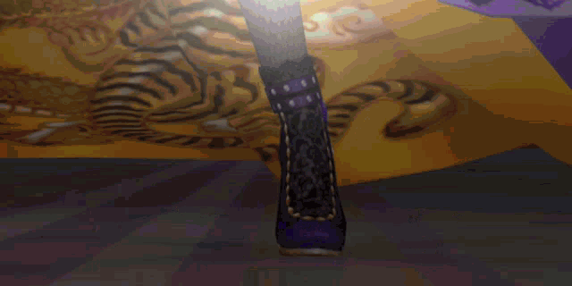 a person wearing purple high heels is standing in front of a tiger painting