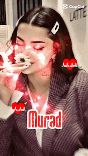 a woman is eating a cake and the name murad is on the bottom right
