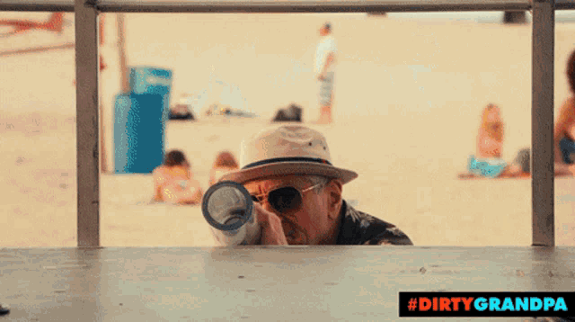 an advertisement for dirty grandpa shows an older man looking through a railing
