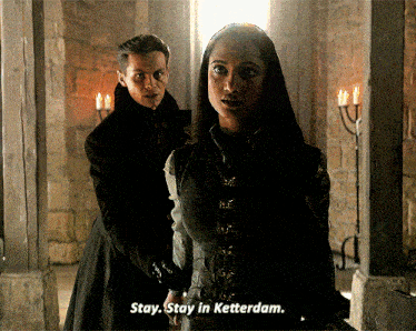 a man and a woman are standing next to each other and the man says " stay stay in ketterdam "