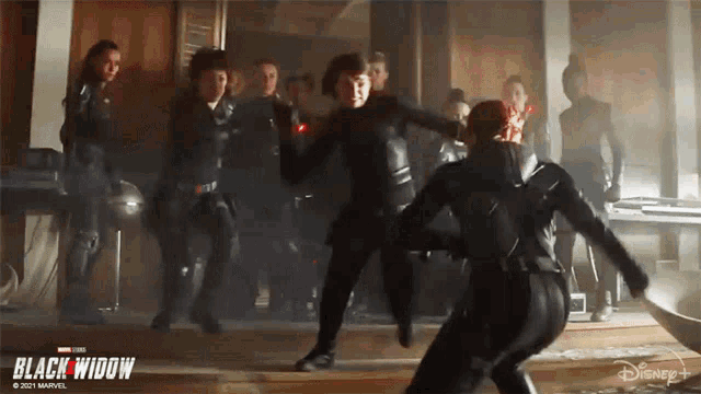 a poster for the movie black widow shows a group of women in black suits