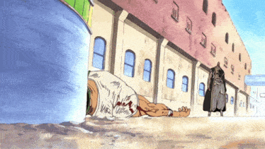 a man laying on the ground in front of a building with the number 9 on it