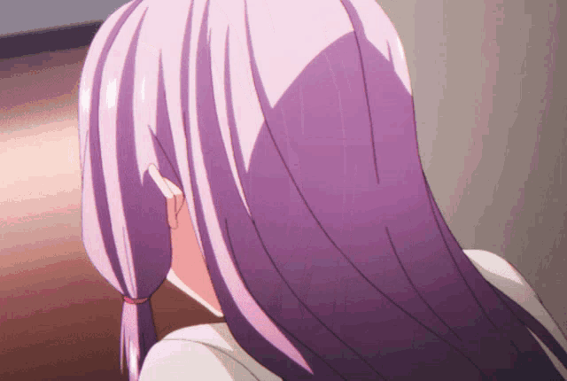 a close up of a girl 's purple hair