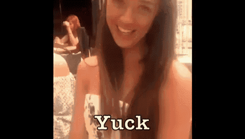 a woman with long hair is smiling and says yuck on the screen