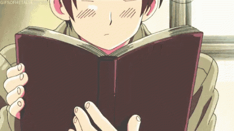 a young boy is reading a book with a gif of him reading it