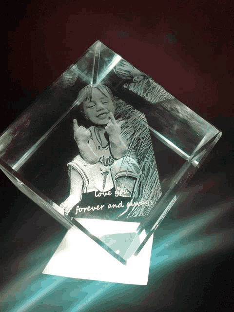 a glass cube with a picture of a little girl and the words love you forever and always