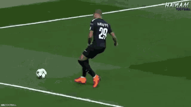 a soccer player with the number 29 on his back kicking a ball