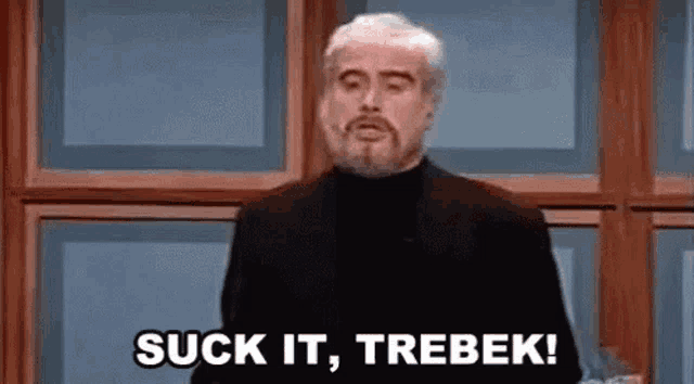 a man with a beard is giving a speech and saying `` suck it , trebek ! ''